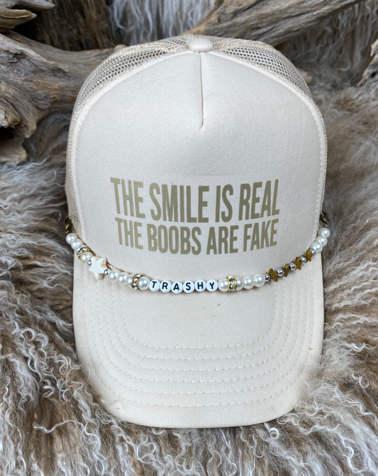 Trucker Ballcap with Beads  The Smile is Real the Boobs are Fake gold/tan